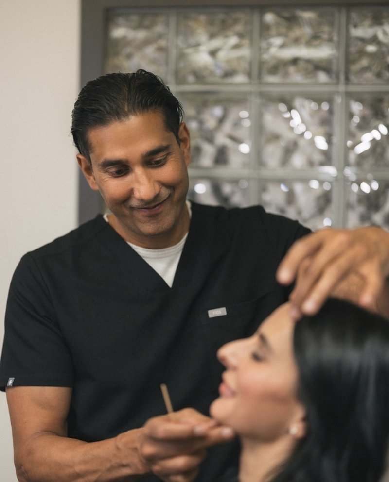Dr. Singh treating a patient at CosMedics Edmonton